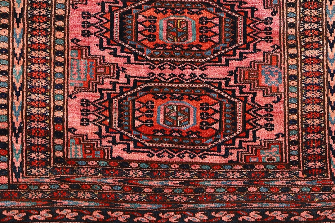 Authentic Afghan Sarik Saruk design wool rug 3x1x6x6 with unusual salmon background, red, blue, brown geometric pattern, and multiple borders