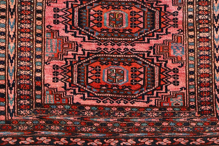 Authentic Afghan Sarik Saruk design wool rug 3x1x6x6 with unusual salmon background, red, blue, brown geometric pattern, and multiple borders