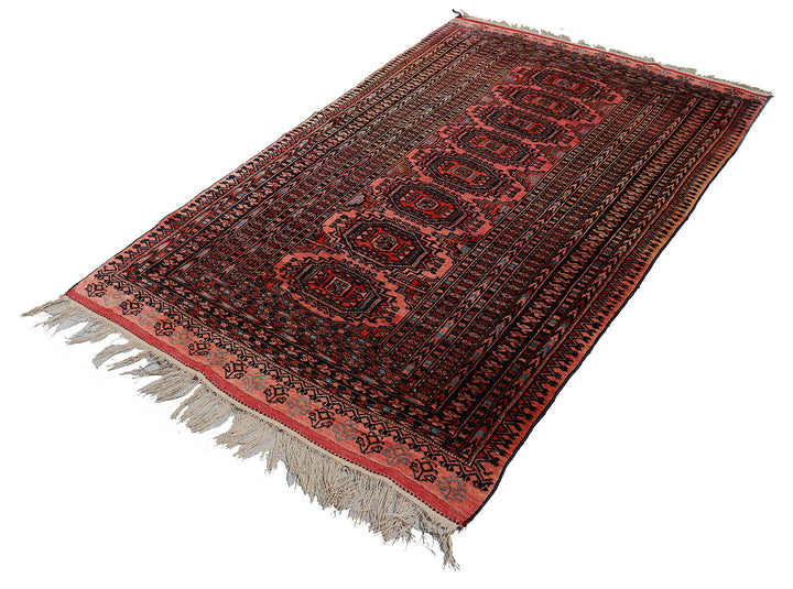 Authentic Afghan Sarik Saruk design wool rug 3x1x6x6 with unusual salmon background, red, blue, brown geometric pattern, and multiple borders