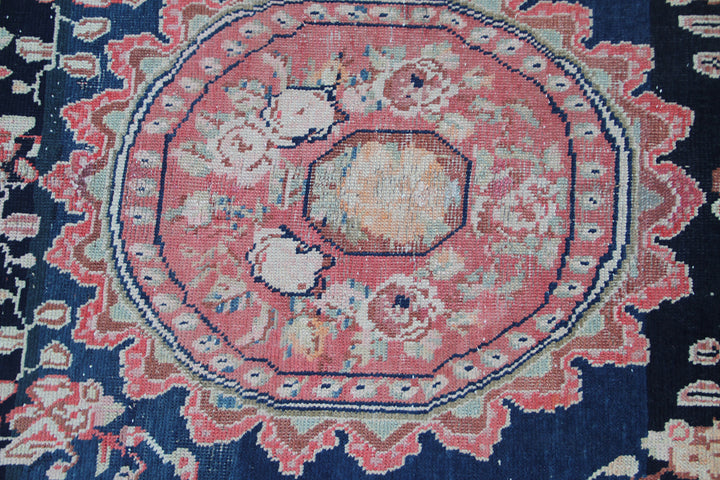 Rare antique Caucasian runner rug featuring 5 distinct geometric medallions on a deep navy blue background with coral, aqua, tan, brown, and green accents