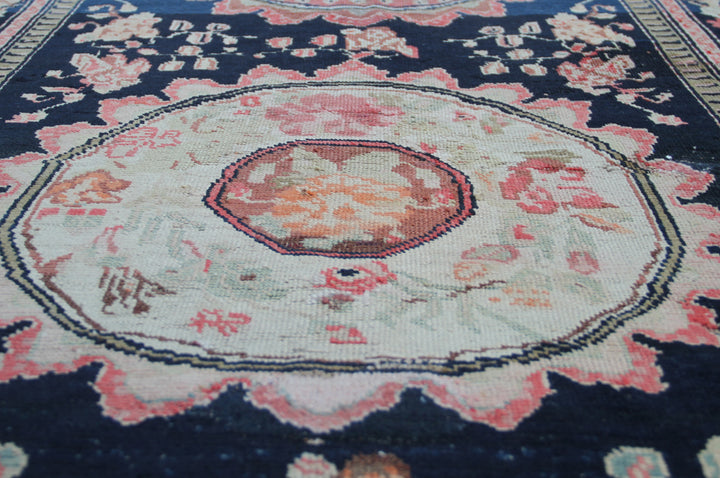 Rare antique Caucasian runner rug featuring 5 distinct geometric medallions on a deep navy blue background with coral, aqua, tan, brown, and green accents