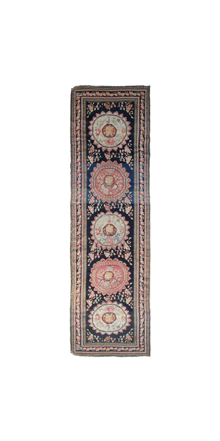 Rare antique Caucasian runner rug featuring 5 distinct geometric medallions on a deep navy blue background with coral, aqua, tan, brown, and green accents