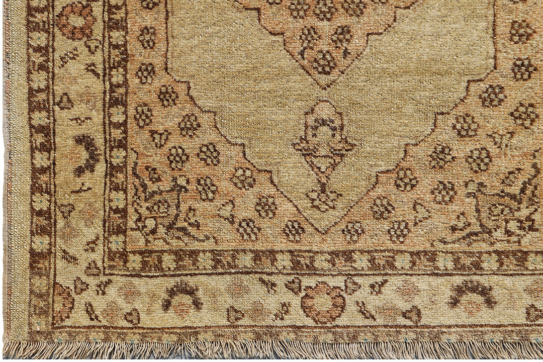 Small antique Haji Jalili design Persian rug featuring tan and gold medallion open field with intricate spandrels and border