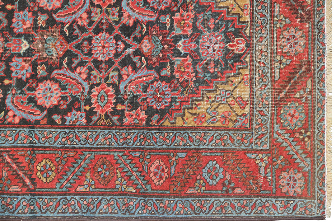 14ft antique early 1900s Persian Heriz runner rug with geometric Herati pattern in warm earth tones