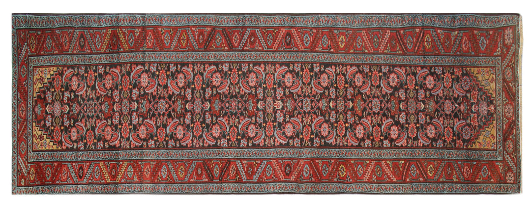 14ft antique early 1900s Persian Heriz runner rug with geometric Herati pattern in warm earth tones