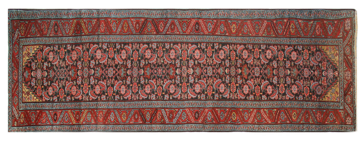 14ft antique early 1900s Persian Heriz runner rug with geometric Herati pattern in warm earth tones
