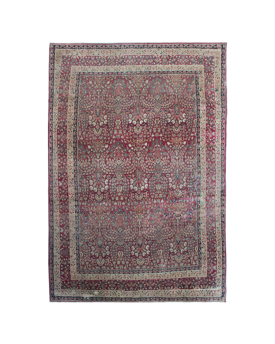 Antique Persian Kermanshah wool area rug featuring intricate floral designs in burgundy, deep navy blue, and white with a low pile