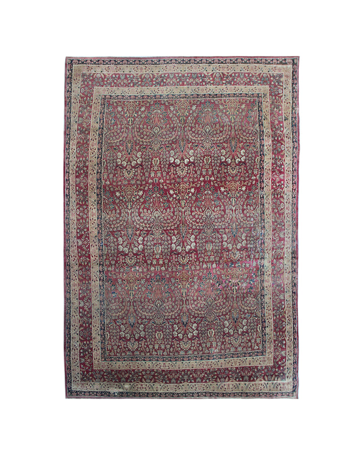Antique Persian Kermanshah wool area rug featuring intricate floral designs in burgundy, deep navy blue, and white with a low pile
