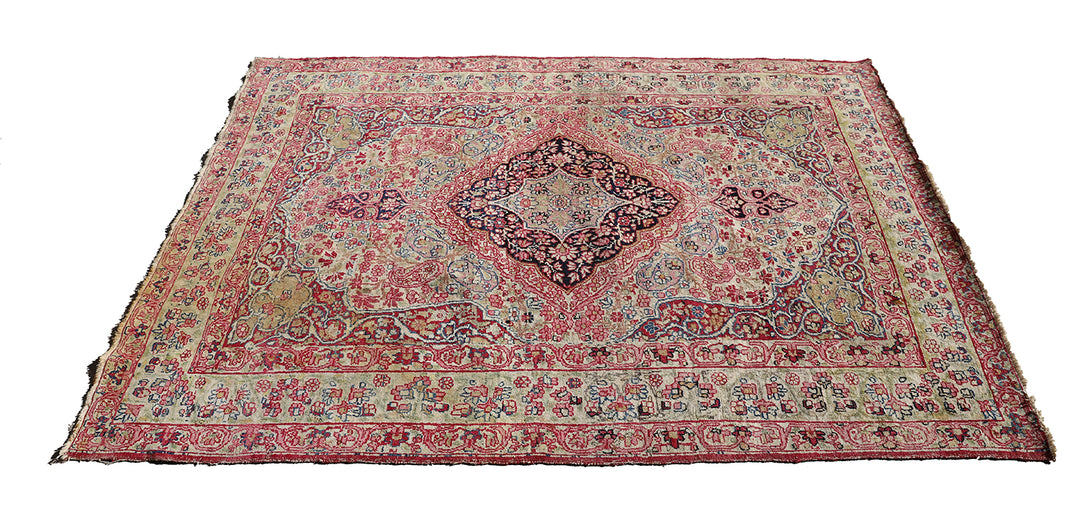 Late 19th-century antique Persian Kermanshah rug featuring a dark navy center medallion on an ivory floral field with pink, red, and blue botanical details