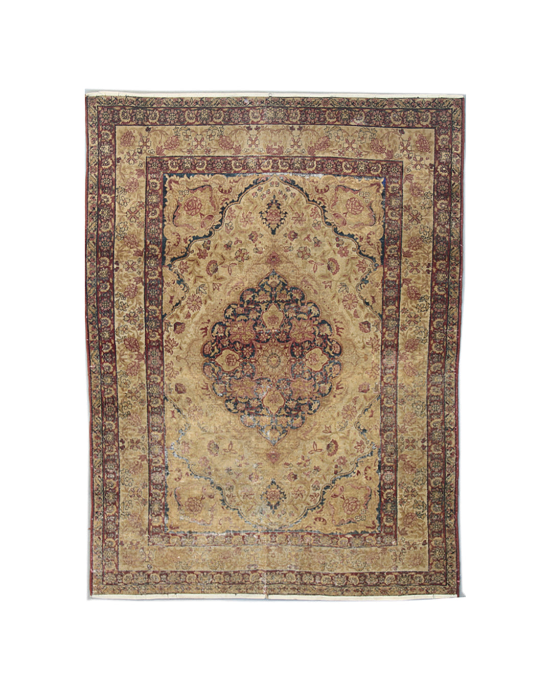 Antique Persian Kermanshah wool area rug with a central floral medallion in warm tan and deep navy blue with low pile