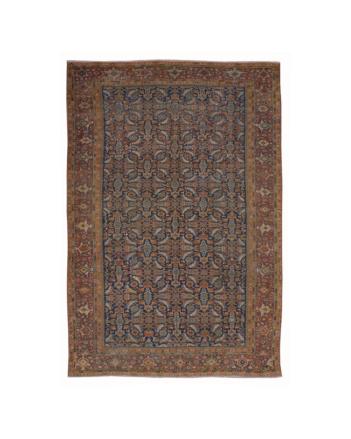 A traditional oriental area rug with an intricate floral and geometric pattern, featuring a dark blue center field, rust-brown borders, and beige accents, shown flat against a white background.