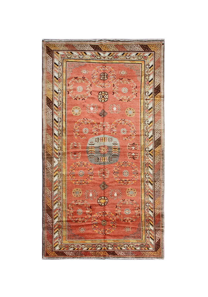 Authentic 2nd quarter 20th century hand-knotted Samarkand Khotan wool rug featuring an orange field with red pink beige botanical medallions