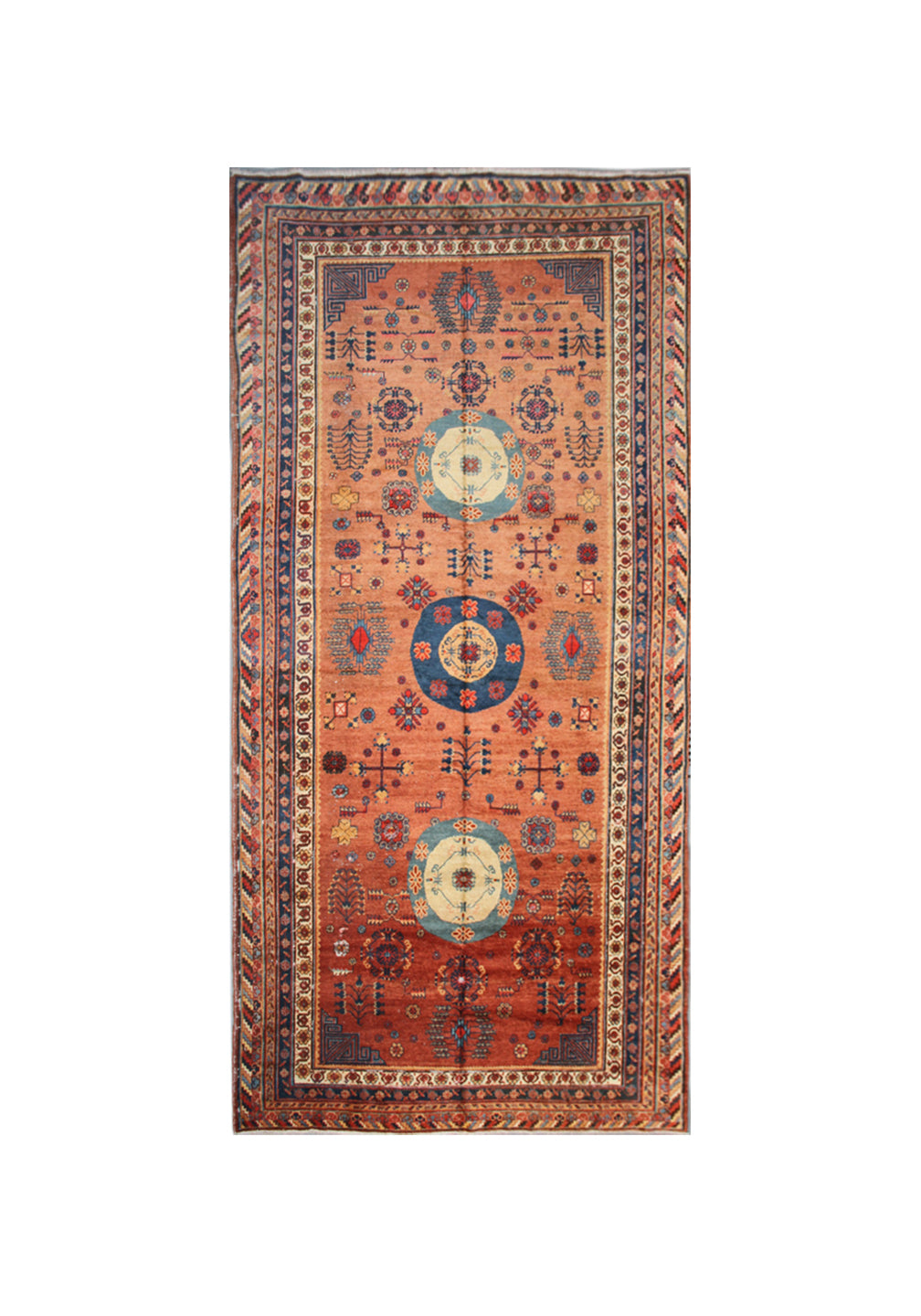Authentic antique hand-knotted Samarkand Khotan wool area rug featuring geometric medallions in blue, rust, and terracotta on a peach and ivory field