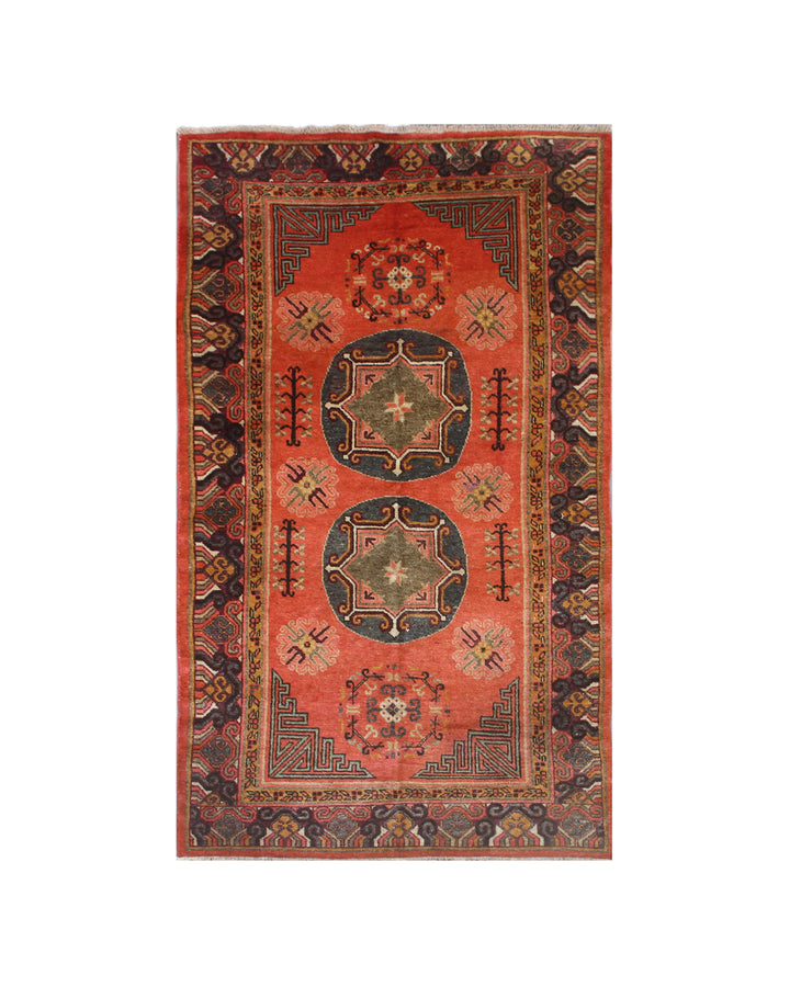 Authentic antique hand-knotted Samarkand Khotan wool area rug featuring two large grey central medallions on a deep red field with salmon brown accents