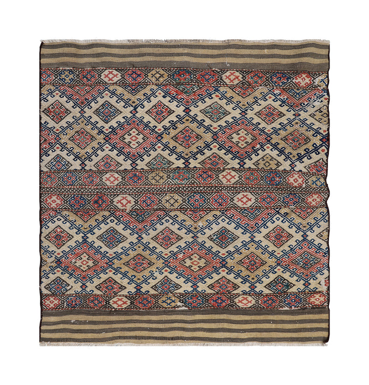 Traditional patterned fabric with geometric design on a white background