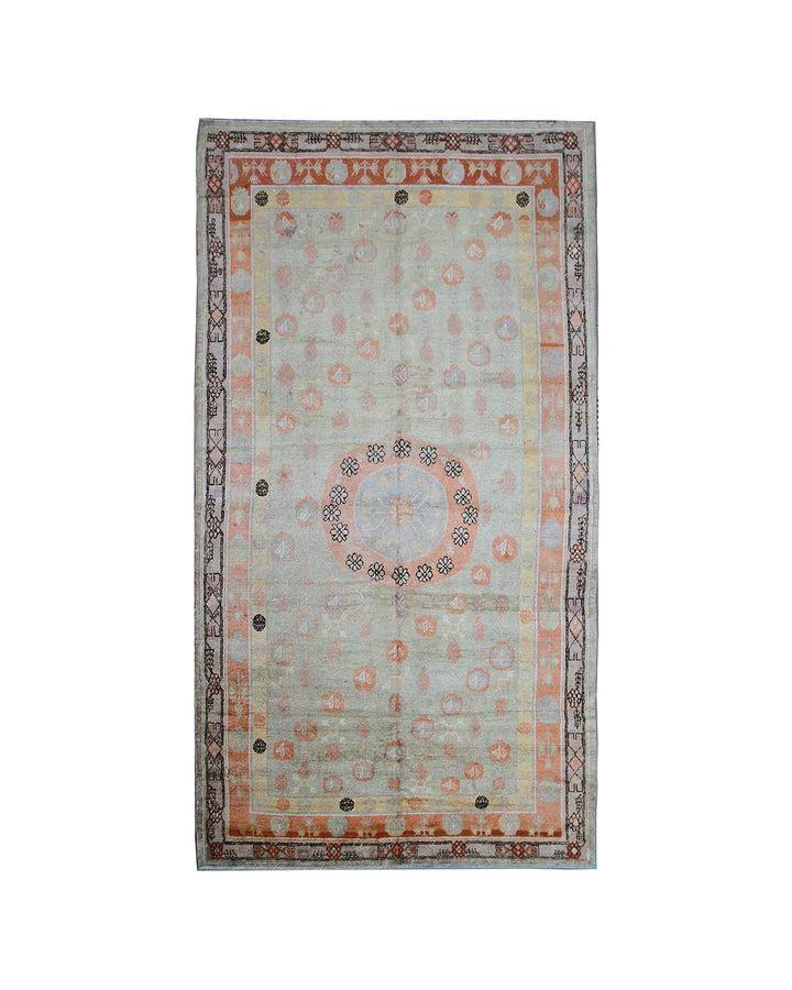 Rare 4x13 antique Samarkand hand-knotted wool gallery runner rug featuring orange medallions on a soft grey background by Ariana Rugs.