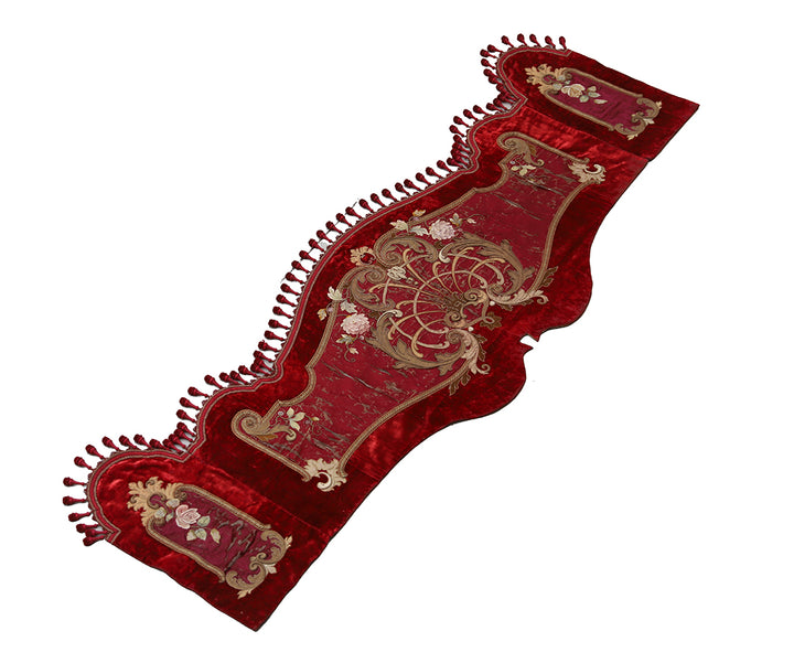 Red embroidered table runner on a white background