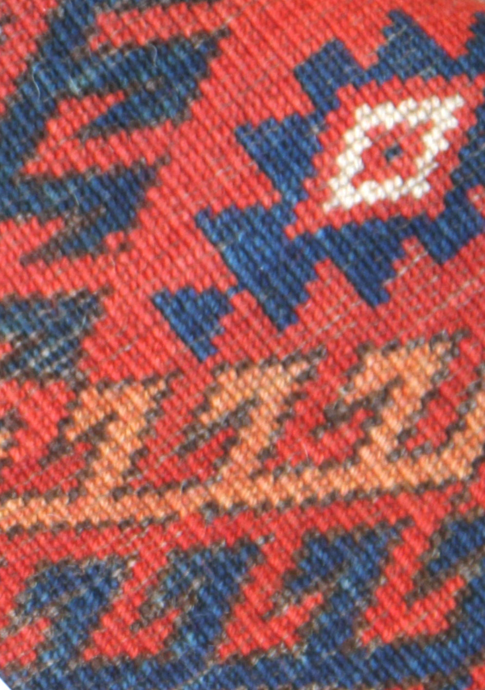 12'2" x 7'6" semi-antique Turkmen main carpet featuring a deep red field with hand-knotted geometric octagonal gul motifs and tribal borders.