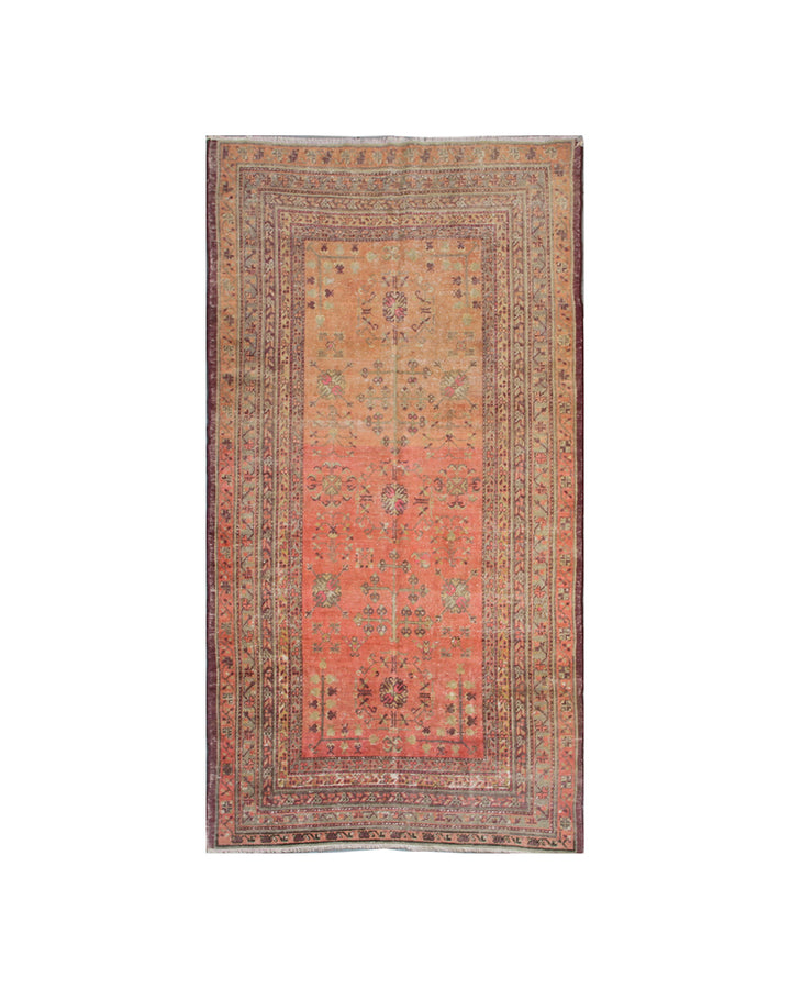 Authentic 5x8 antique Samarkand hand-knotted wool area rug featuring an all-over soft terracotta medallion design on a washed-out red field by Ariana Rugs.