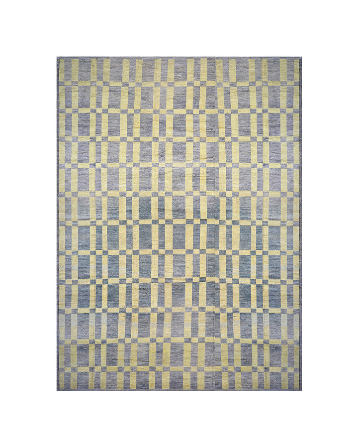 An overhead view of a massive 16x20 authentic Moroccan style long pile shag rug from the Ariana Barchi Collection, featuring a grey and yellow geometric pattern hand-woven by Hazara women weavers.
