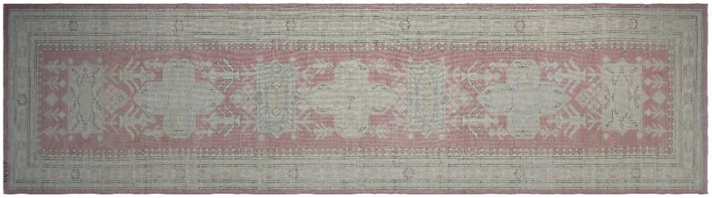 Unique hand-knotted Ariana Hazara Caucasian runner rug with geometric designs in pink, ivory, blue, and brown