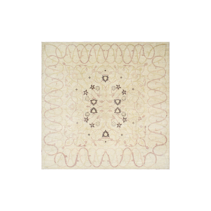 Decorative quilt with intricate patterns on a beige background