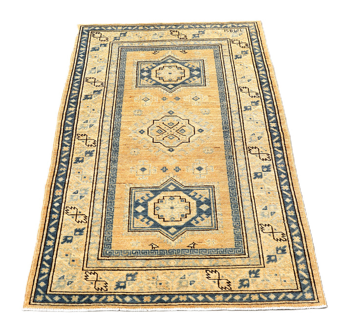 Hand-knotted 2'9"x4'2" Ariana Hazara rug featuring blue geometric medallions on an apricot background