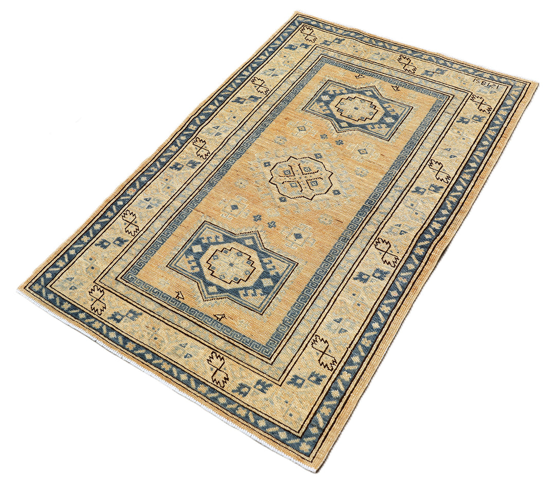 Hand-knotted 2'9"x4'2" Ariana Hazara rug featuring blue geometric medallions on an apricot background