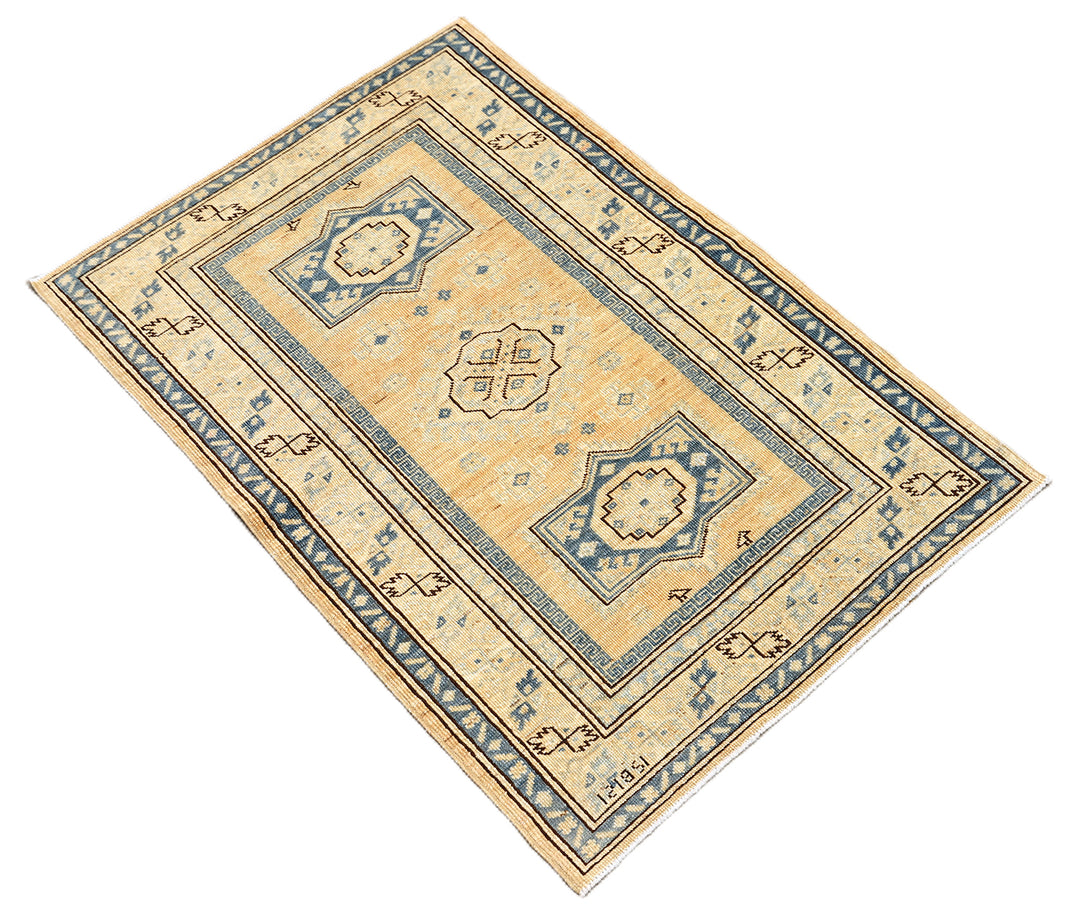 Hand-knotted 2'9"x4'2" Ariana Hazara rug featuring blue geometric medallions on an apricot background