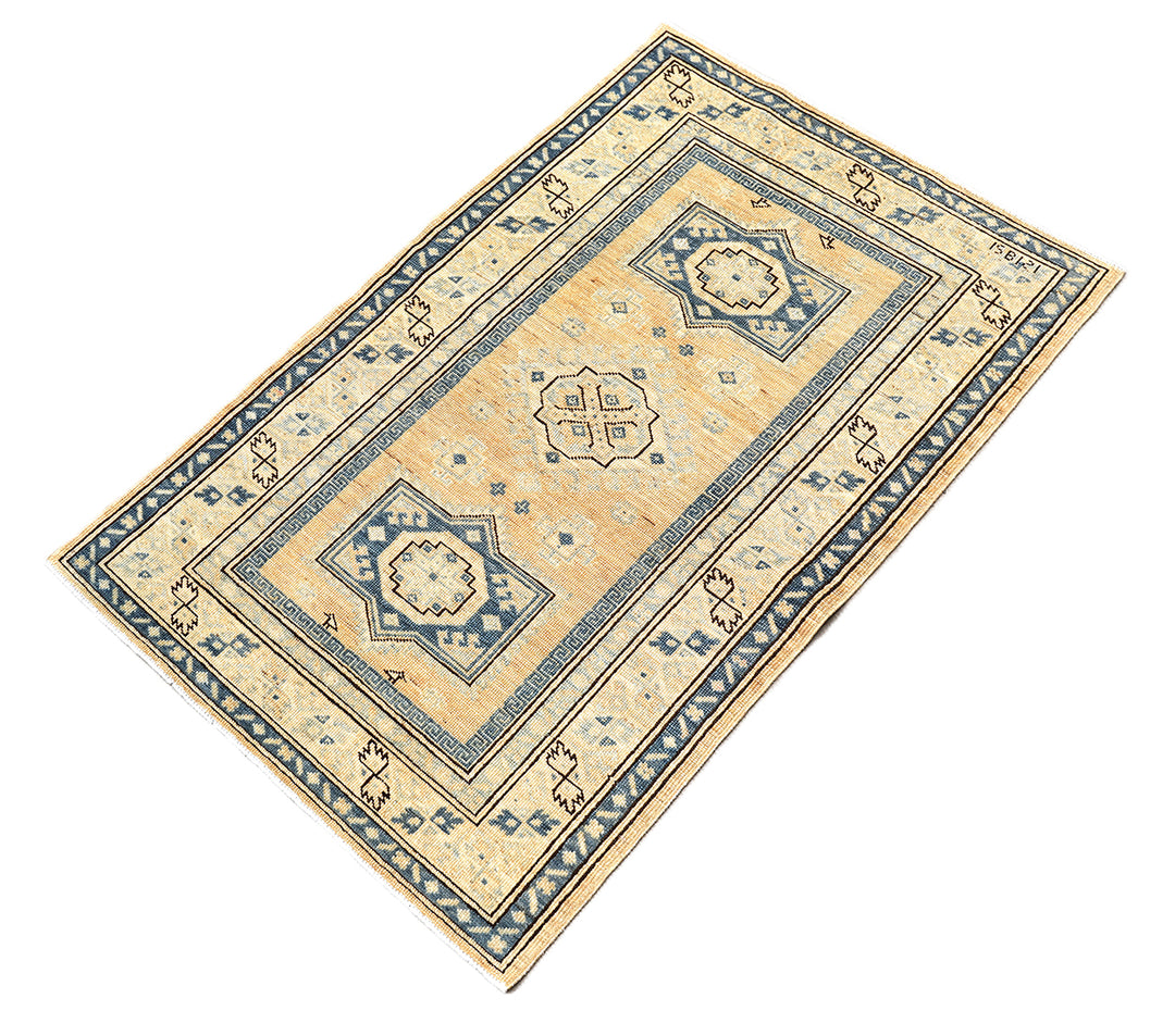 Hand-knotted 2'9"x4'2" Ariana Hazara rug featuring blue geometric medallions on an apricot background