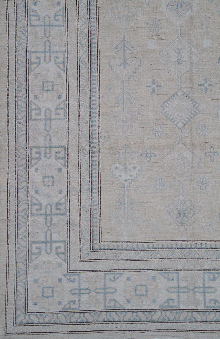 Authentic Ariana Hazara Collection 10x13 hand-knotted wool rug featuring geometric Caucasian tribal design in tan, blue, black, and white colors.