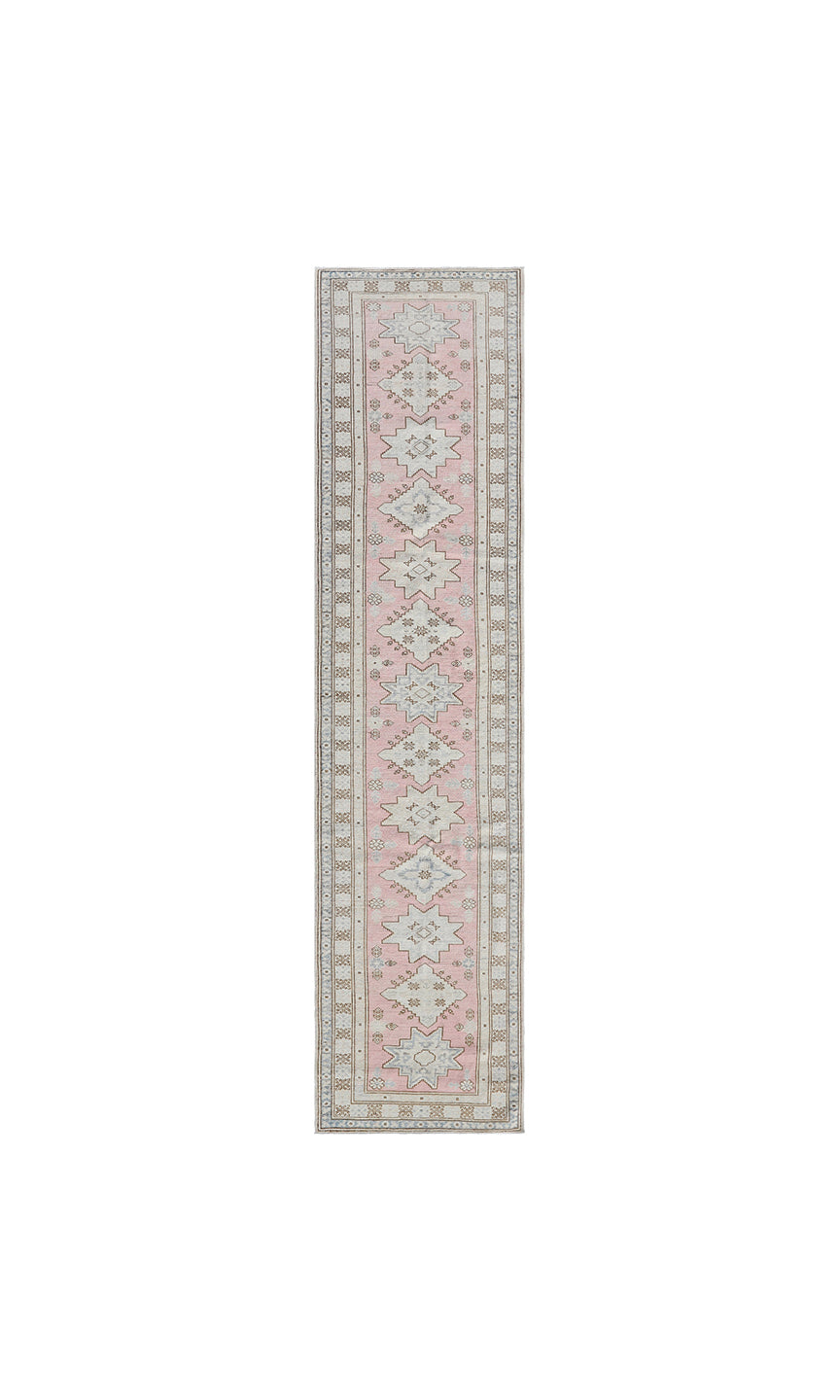 Fine hand-knotted Ariana Kazak Hazara wool runner rug featuring geometric tribal patterns in pink, ivory, and blue