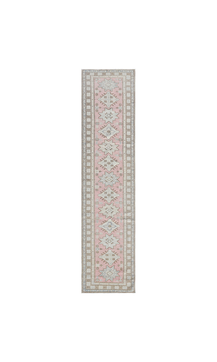 Fine hand-knotted Ariana Kazak Hazara wool runner rug featuring geometric tribal patterns in pink, ivory, and blue