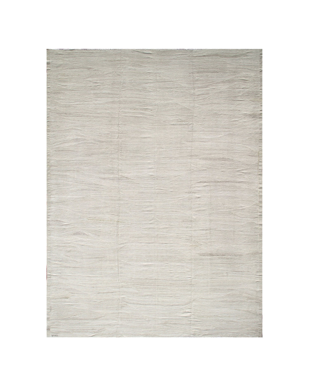 Large earth-tone flatweave Ariana kilim rug in natural undyed organic wool with subtle woven texture.
