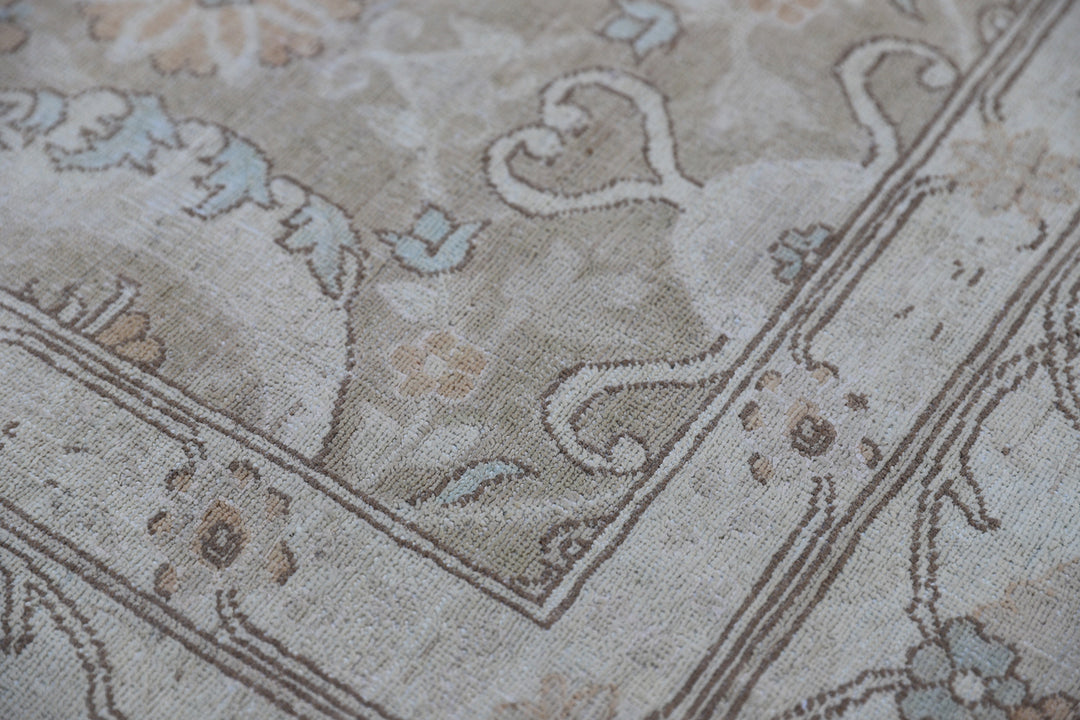 Oversized 11x15 Ariana Luxury hand-knotted Afghan wool and silk rug with Persian pattern in soft gold, blue, and ivory, full view.