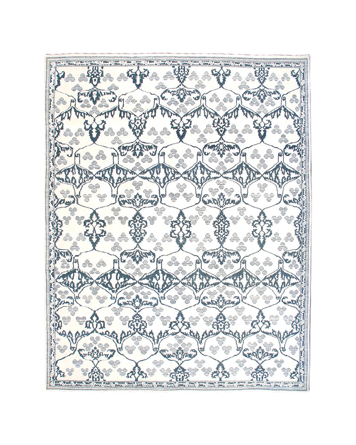 Ariana Modern Collection 8x10 hand-knotted Afghan rug ethically crafted in Afghanistan featuring a stark white cotton background with a fine indigo Ottoman design.