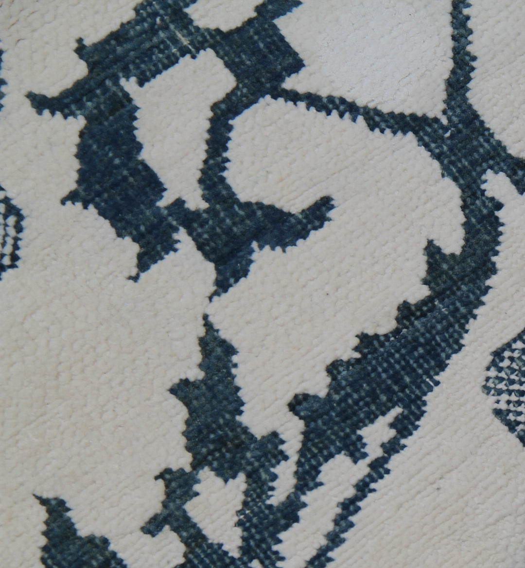 Ariana Modern Collection 8x10 hand-knotted Afghan rug ethically crafted in Afghanistan featuring a stark white cotton background with a fine indigo Ottoman design.