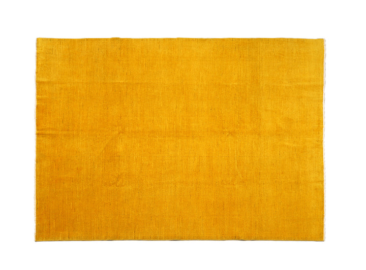 7'x9'9" hand-knotted yellow geometric Ariana overdyed wool rug featuring subtle artisan details and vibrant yellow tones
