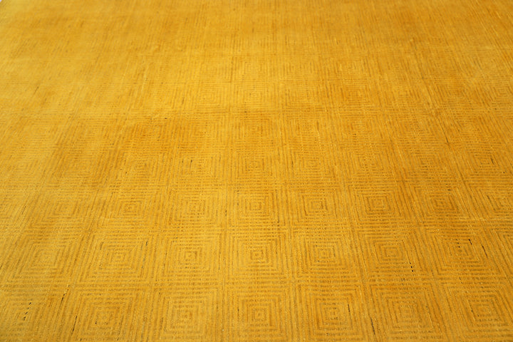 7'x9'9" hand-knotted yellow geometric Ariana overdyed wool rug featuring subtle artisan details and vibrant yellow tones