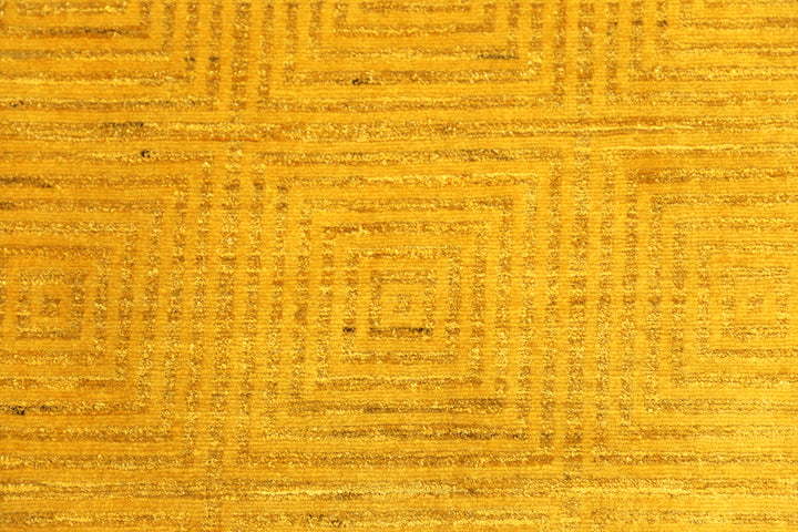 7'x9'9" hand-knotted yellow geometric Ariana overdyed wool rug featuring subtle artisan details and vibrant yellow tones