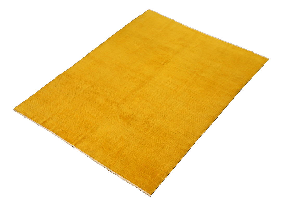 7'x9'9" hand-knotted yellow geometric Ariana overdyed wool rug featuring subtle artisan details and vibrant yellow tones