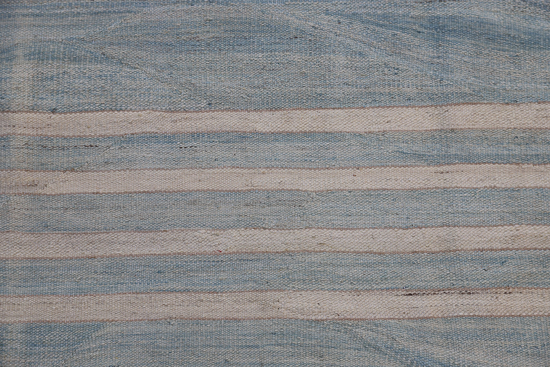 Ariana Rugs 10'x14' handwoven soft blue and ivory striped wool kilim area rug featuring a modern flatweave structure on a cotton foundation.