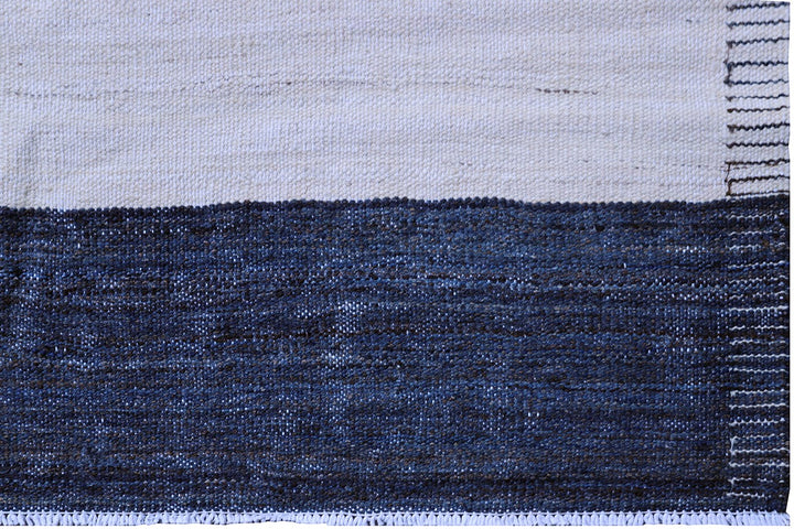 Ariana Rugs 12'x17' handwoven navy and white striped wool kilim area rug featuring a clean flatweave construction on a cotton foundation.