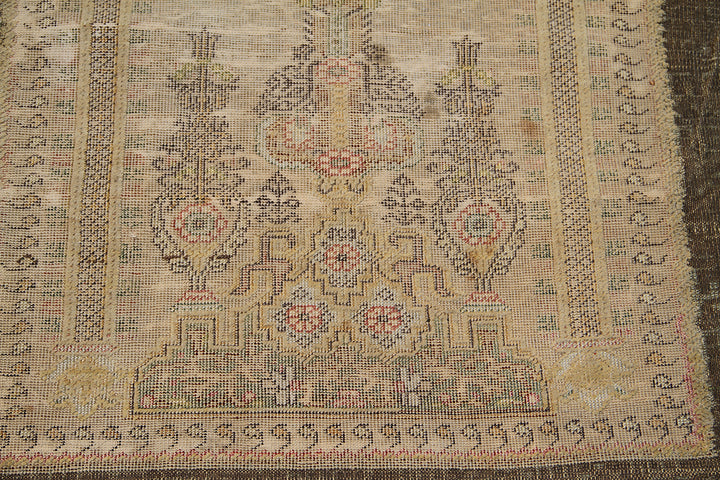 Luxury antique Turkish metal embroidered prayer rug in bronze-brown curated by Ariana Rugs West Hollywood for interior designers.