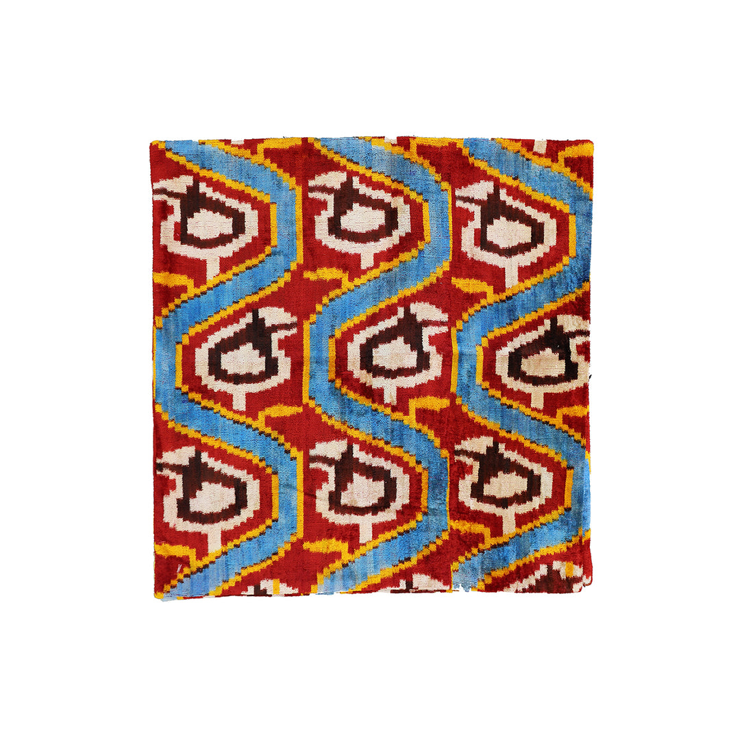 Handmade 2x2 Uzbek Paisley luxury wool pillow cover in blue, red, yellow, and white by Ariana Rugs in West Hollywood