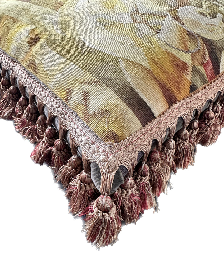 Luxury hand-knotted yellow and brown human face Aubusson pillow case with tassels made from organic wool by expert weavers, curated by Ariana Rugs West Hollywood.