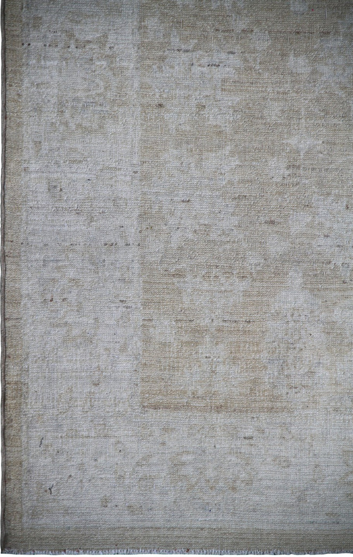 Elevated detail view of an authentic 7'5" x 3'1" Ariana traditional hand-knotted wool runner rug showcasing delicate floral patterns in a soft, elegant color palette.