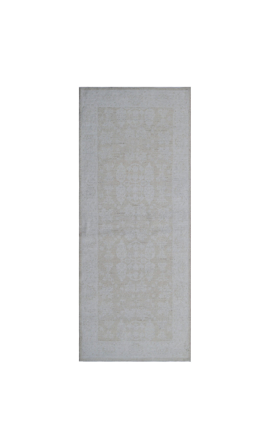 Elevated detail view of an authentic 7'5" x 3'1" Ariana traditional hand-knotted wool runner rug showcasing delicate floral patterns in a soft, elegant color palette.
