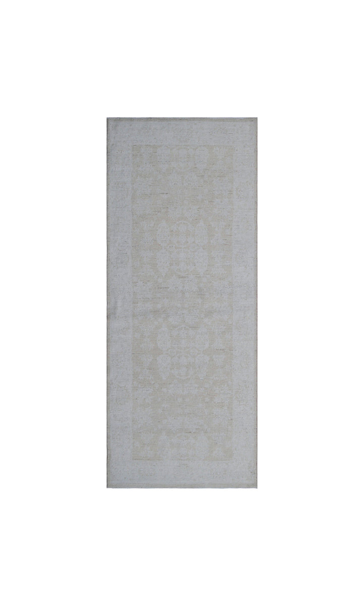 Elevated detail view of an authentic 7'5" x 3'1" Ariana traditional hand-knotted wool runner rug showcasing delicate floral patterns in a soft, elegant color palette.
