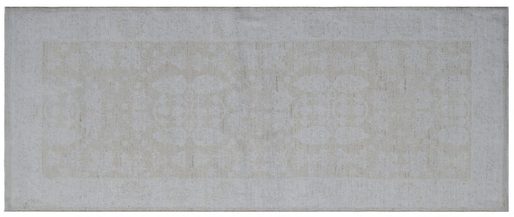 Elevated detail view of an authentic 7'5" x 3'1" Ariana traditional hand-knotted wool runner rug showcasing delicate floral patterns in a soft, elegant color palette.